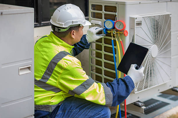 Professional Air Duct Cleaning technician working in Kalona, IA